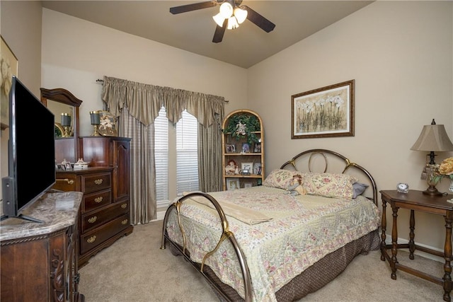 bedroom with ceiling fan and light colored carpet