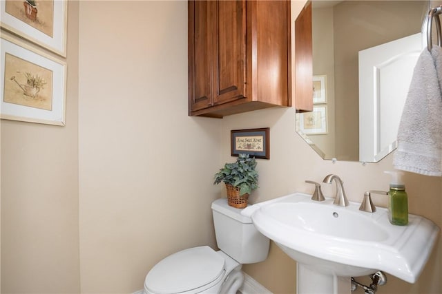 bathroom with toilet and sink