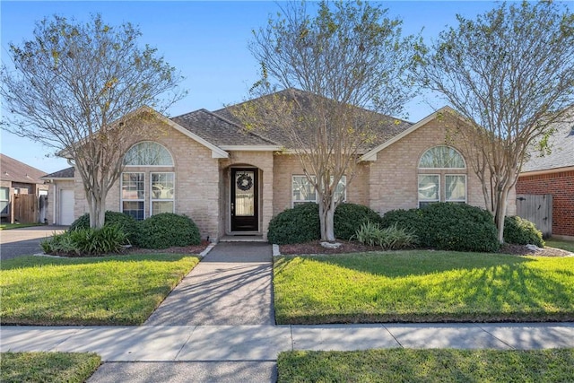 single story home featuring a front yard