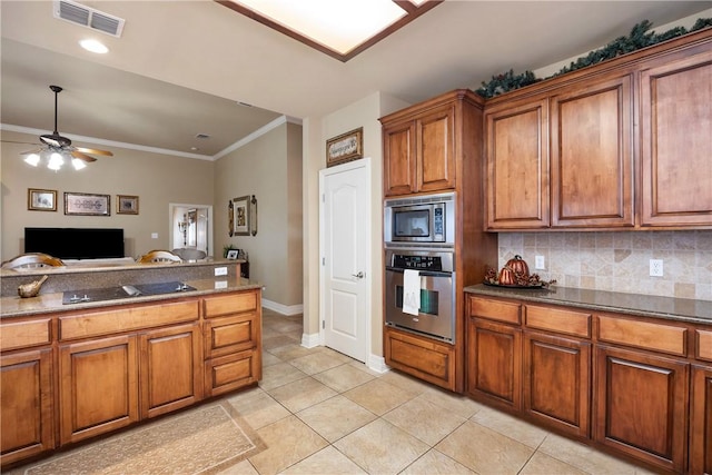 kitchen with ceiling fan, light tile patterned floors, stainless steel appliances, and tasteful backsplash