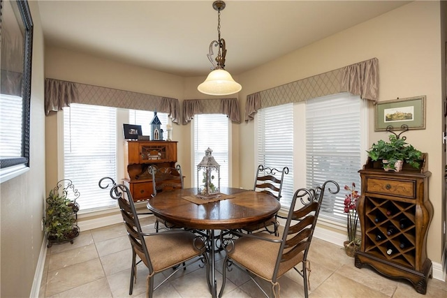 dining area with light tile patterned flooring