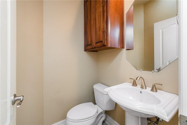 7510 Beau Terre, Corpus Christi, TX 78414 - half bath with baseboards, toilet, and a sink