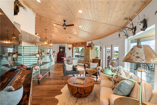 living room featuring ceiling fan with notable chandelier, hardwood / wood-style flooring, and wood ceiling