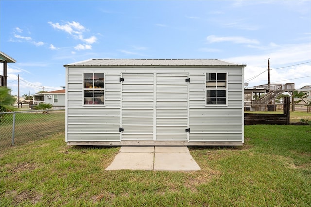 view of outdoor structure with a lawn