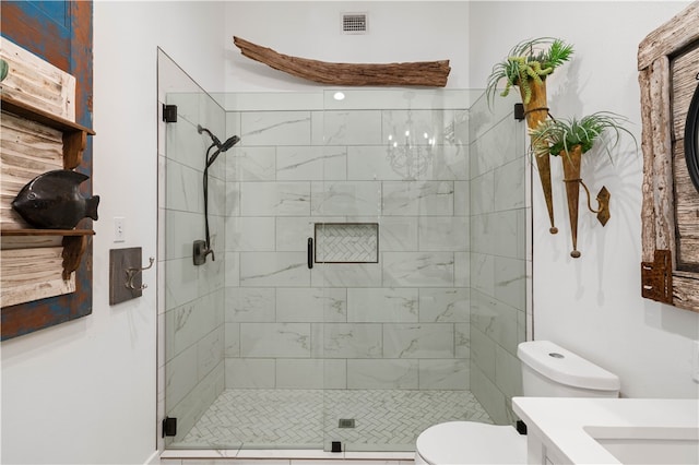 bathroom featuring vanity, toilet, and walk in shower