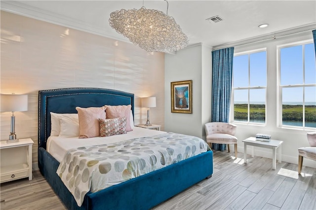 144 Sunrise Ave, Port Aransas, TX 78373 - bedroom with baseboards, wood finished floors, ornamental molding, and recessed lighting