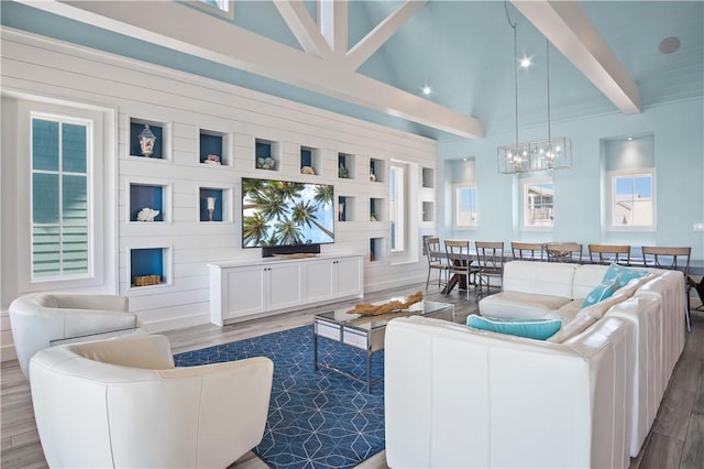144 Sunrise Ave, Port Aransas, TX 78373 - living room with wood finished floors and a chandelier