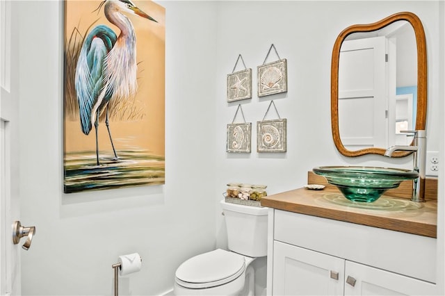 144 Sunrise Ave, Port Aransas, TX 78373 - half bathroom with toilet and vanity