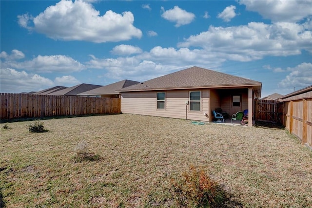 back of house with a yard