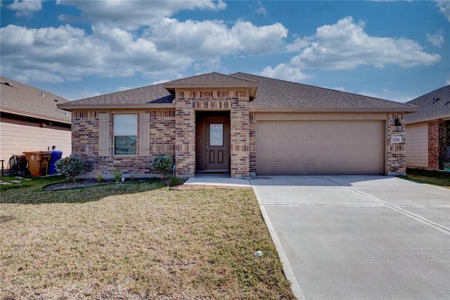 view of front of home with a garage and a front lawn