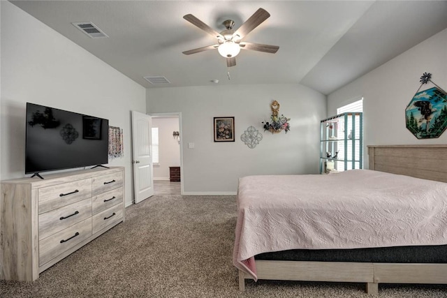 bedroom with vaulted ceiling, ceiling fan, and carpet flooring