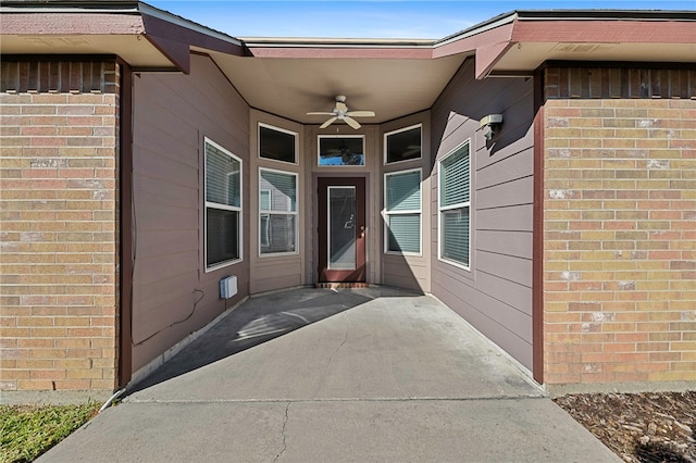 property entrance with ceiling fan and a patio