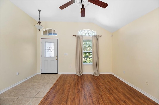 126 Whistlers Cove Rd, Rockport, TX 78382 - foyer featuring vaulted ceiling, ceiling fan, light wood-type flooring, and baseboards