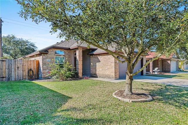 view of front of house with a garage and a front lawn