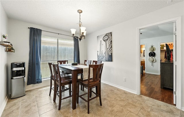2722 Camargo Dr, Corpus Christi, TX 78415 - dining area featuring a chandelier and a textured ceiling