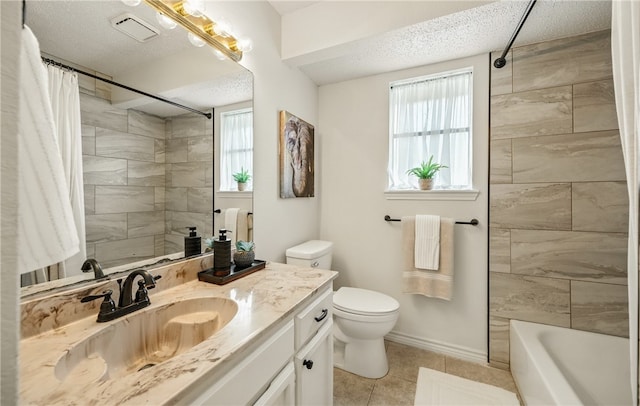 2722 Camargo Dr, Corpus Christi, TX 78415 - bathroom featuring vanity, tile patterned flooring, shower / tub combo, and a textured ceiling
