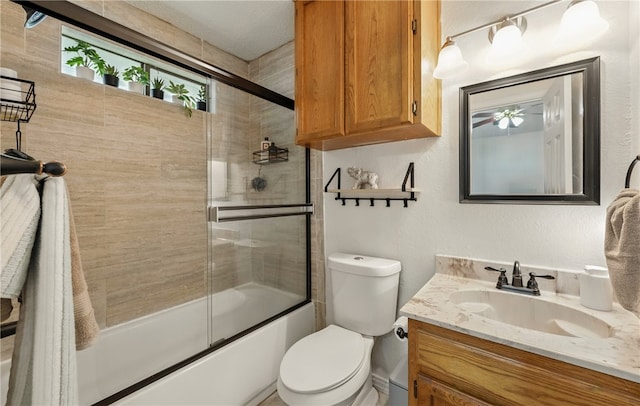 2722 Camargo Dr, Corpus Christi, TX 78415 - bathroom featuring vanity, combined bath / shower with glass door, and ceiling fan