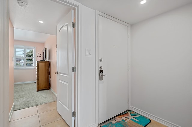 corridor with light tile patterned floors