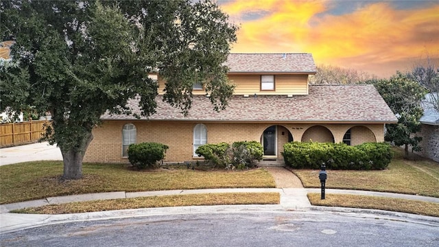 view of front of property with a yard