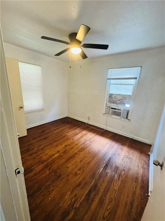 1725 Sycamore Pl, Corpus Christi, TX 78416 - spare room with cooling unit, wood finished floors, ceiling fan, and baseboards
