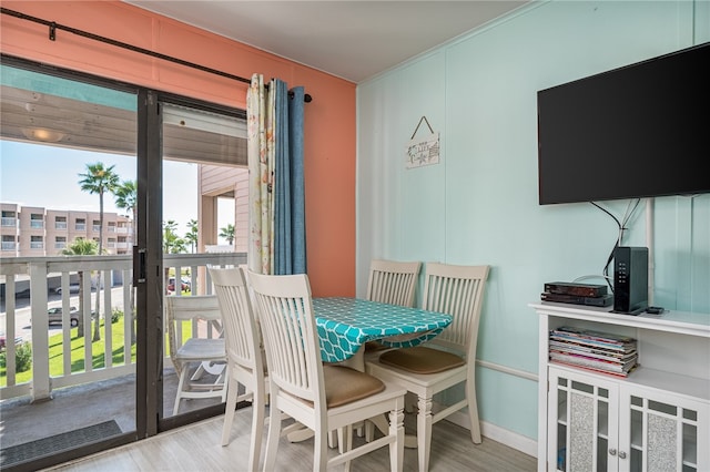 dining space featuring light wood-type flooring