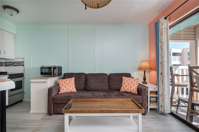 living room with light hardwood / wood-style flooring