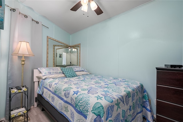 bedroom featuring light wood-type flooring and ceiling fan