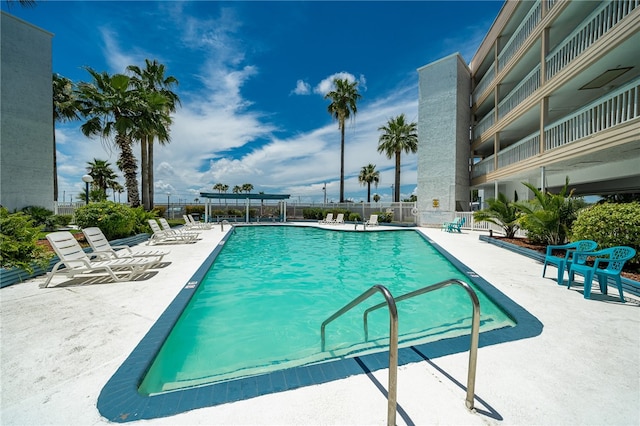 view of swimming pool with a patio area