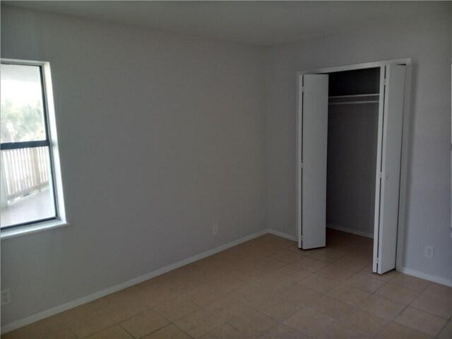 5973 State Highway 361 Unit 121, Port Aransas, TX 78373 - unfurnished bedroom with baseboards and a closet