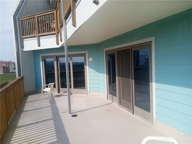 view of patio with a balcony