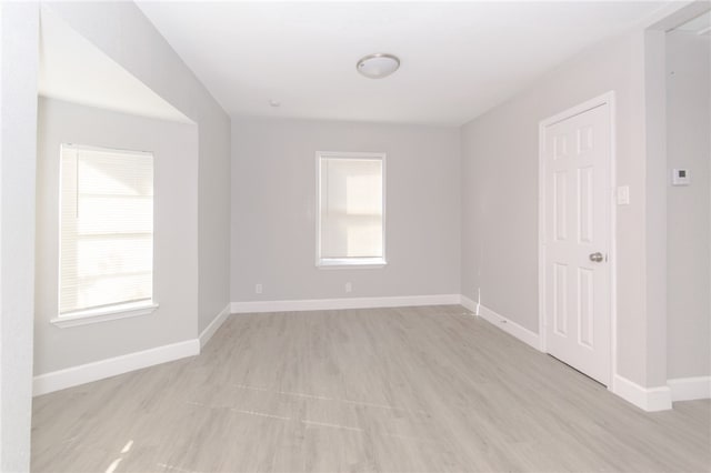 spare room with light wood-type flooring