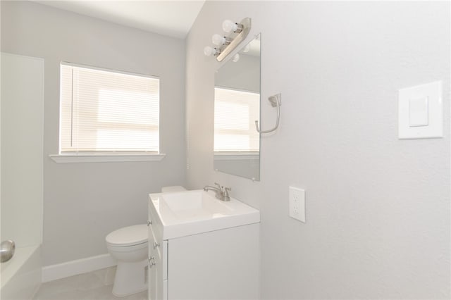 bathroom with tile patterned floors, vanity, and toilet