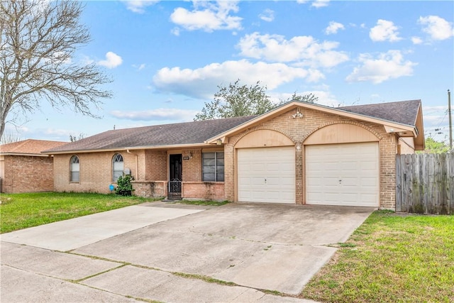 ranch-style home featuring brick siding, a front yard, fence, a garage, and driveway