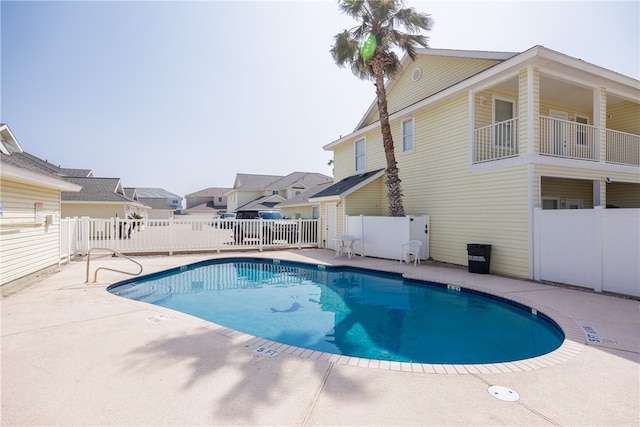 view of swimming pool with a patio area