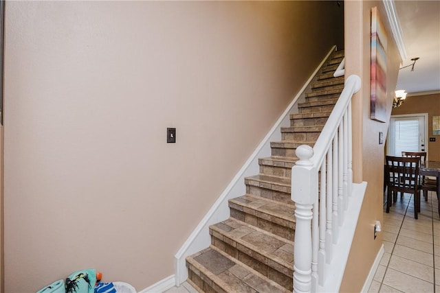 15102 Leeward Dr Unit 502, Corpus Christi, TX 78418 - staircase featuring tile patterned flooring, baseboards, and a chandelier