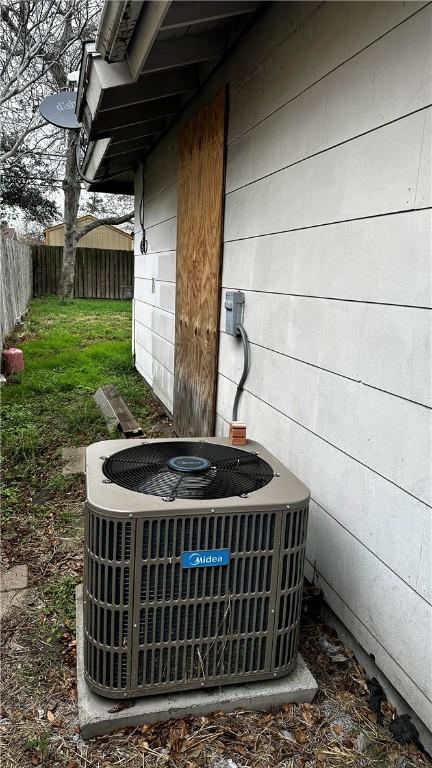 details with a fenced backyard and cooling unit