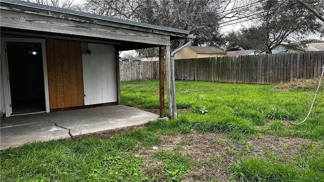 view of yard featuring a patio area and a fenced backyard