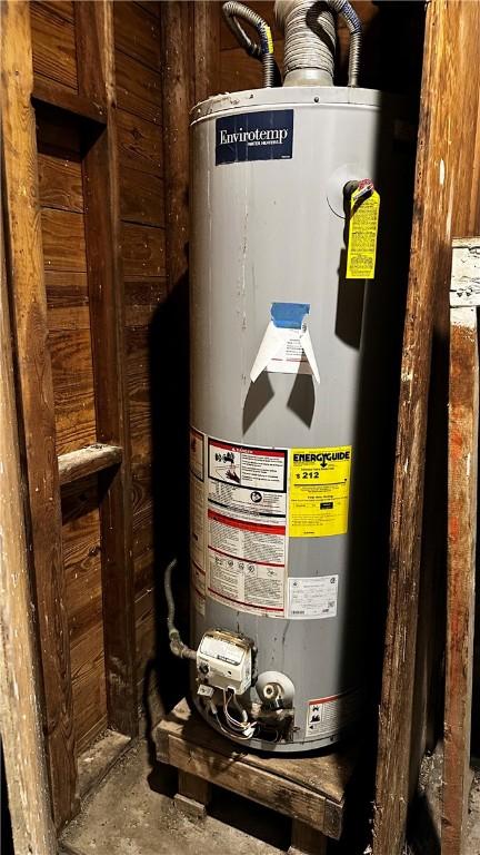 utility room featuring gas water heater