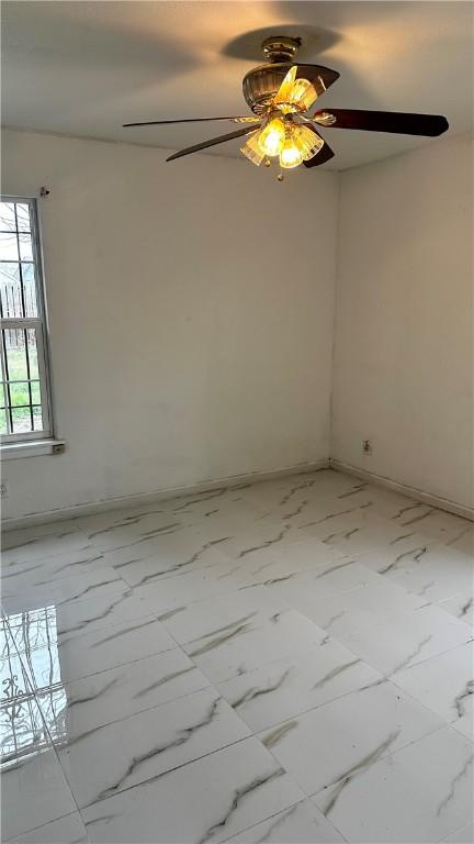 empty room featuring marble finish floor