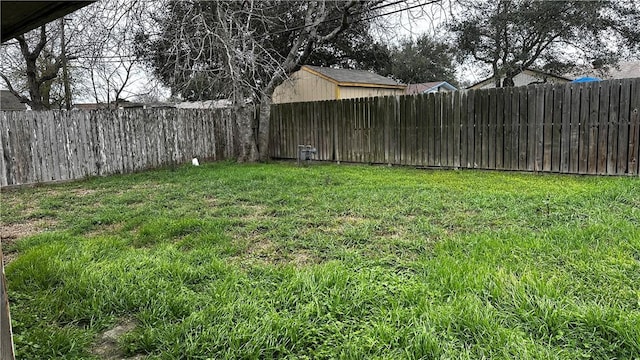 view of yard with a fenced backyard