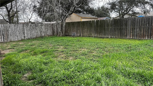 view of yard featuring a fenced backyard