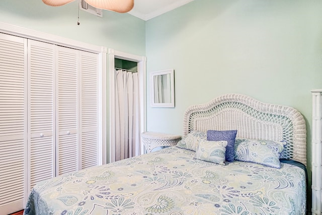 bedroom with crown molding and visible vents