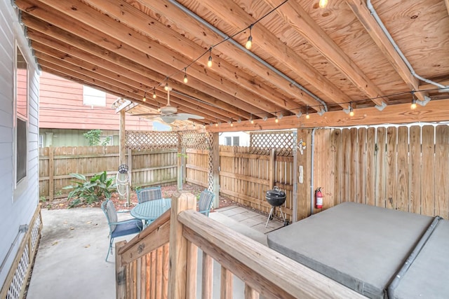 view of patio / terrace with ceiling fan and fence