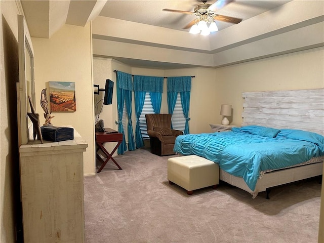 bedroom featuring ceiling fan and light carpet