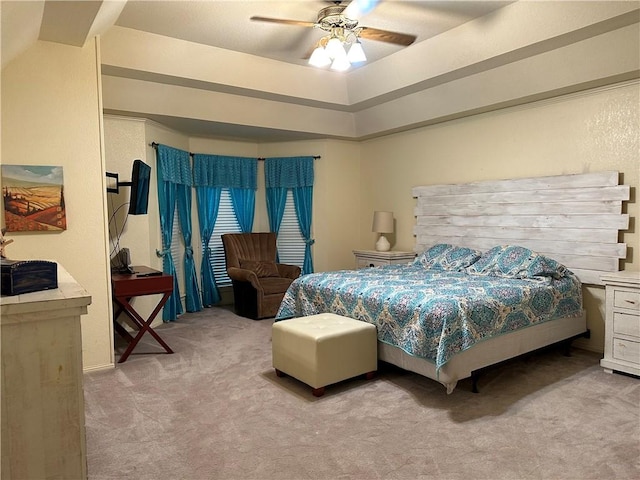 bedroom featuring ceiling fan and light carpet