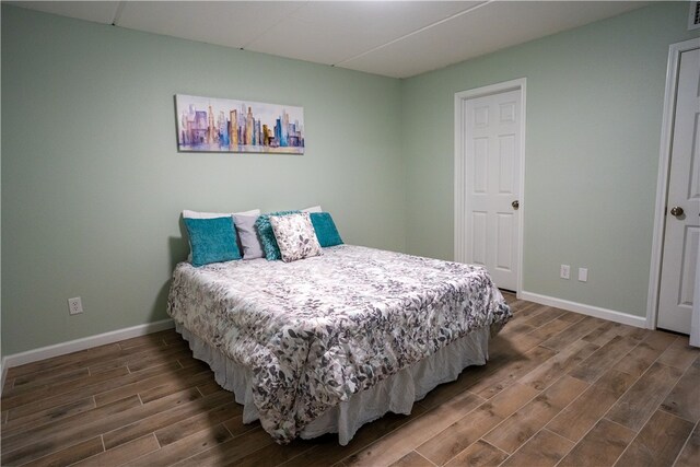 4334 E Ocean Dr Unit 306, Corpus Christi, TX 78404 - bedroom featuring wood finished floors