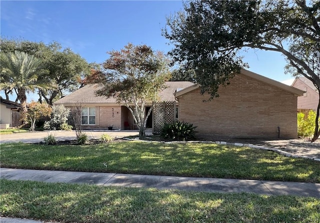 ranch-style house with a front lawn