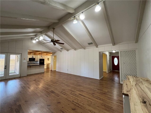 unfurnished living room with ceiling fan, dark wood-type flooring, lofted ceiling with beams, and french doors