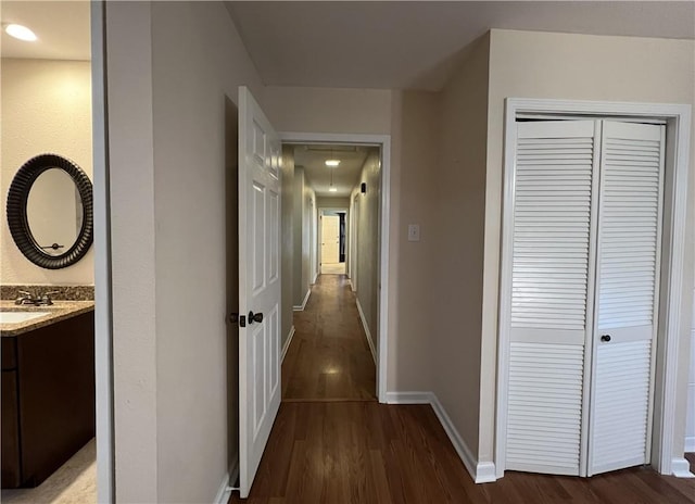 corridor featuring dark hardwood / wood-style floors