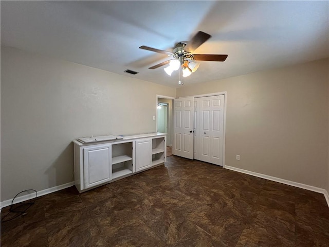 unfurnished bedroom featuring a closet and ceiling fan